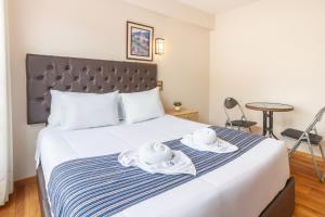 Postel nebo postele na pokoji v ubytování Cusco Hostal Qolla Wasi-II