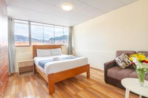 Postel nebo postele na pokoji v ubytování Cusco Hostal Qolla Wasi-II