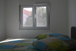 Postel nebo postele na pokoji v ubytování Apartments Šuker