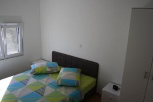 Postel nebo postele na pokoji v ubytování Apartments Šuker