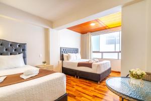 Postel nebo postele na pokoji v ubytování Cusco Hostal Qolla Wasi-II