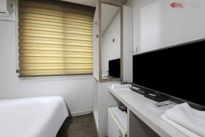 TV a/nebo společenská místnost v ubytování Hotel CL