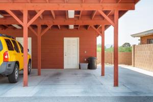 a garage with a car parked in front of it at Spring Escape 1BR by UA DT Just 2 Min to Banner in Tucson
