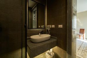 a bathroom with a sink and a mirror at Pyramids Secret Hotel in Cairo +90 photos