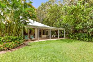 a house with a pavilion in the middle of a yard at Mirage Resort Villa 438 with access to Sheraton Facilities in Port Douglas