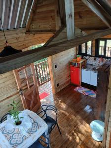 an overhead view of a kitchen in a cabin at Casa na arvore Dream tree house in Santa Clara dʼOeste