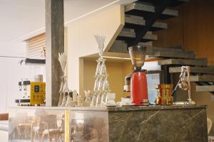 a counter with a bunch of glass items on it at Pyramids Secret Hotel in Cairo