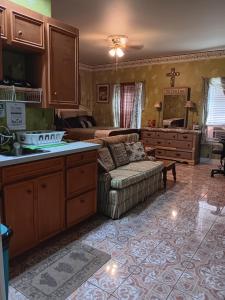 a living room with a couch and a bed at Klauzz in Bay City