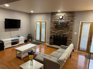 a living room with a couch and a fireplace at Near To CCBC ESSEX Private Room 201 in Parkville