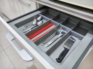 a drawer with silver utensils in a kitchen at Riverine Diamond 7 RDB Studio CK - Free 1 Parking, Netflix & Cozy Retreat Couples, Families in Kuching