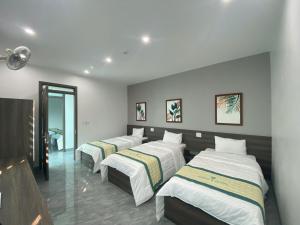 Ένα ή περισσότερα κρεβάτια σε δωμάτιο στο GREEN Hotel & Coffee