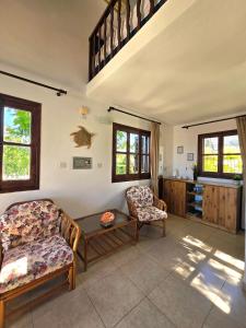 Гостиная зона в Five Fingers Holiday Bungalows
