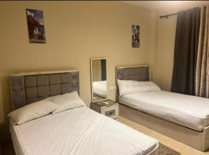 Ένα ή περισσότερα κρεβάτια σε δωμάτιο στο Azha Ain Sokhna Apartment private fully air-conditioned +19 φωτογραφίες