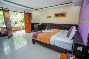 Postel nebo postele na pokoji v ubytování The Tanis Beach Resort Nusa Lembongan