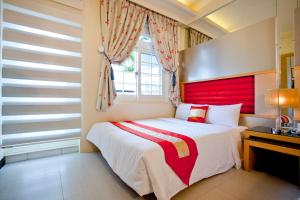 Postel nebo postele na pokoji v ubytování 墾丁合歡8宿-Ho Huan B & B
