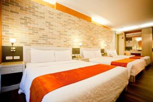 Postel nebo postele na pokoji v ubytování 墾丁合歡8宿-Ho Huan B & B