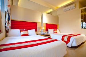 Postel nebo postele na pokoji v ubytování 墾丁合歡8宿-Ho Huan B & B