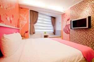 TV a/nebo společenská místnost v ubytování 墾丁合歡8宿-Ho Huan B & B