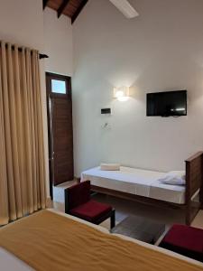 TV a/nebo společenská místnost v ubytování Hotel Kamrel Sigiriya