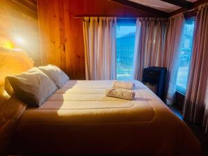 Postelja oz. postelje v sobi nastanitve Hostal Chumay