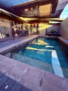 a swimming pool in the side of a house at Isle views Newell Beach 15min to Port Douglas in Newell Beach
