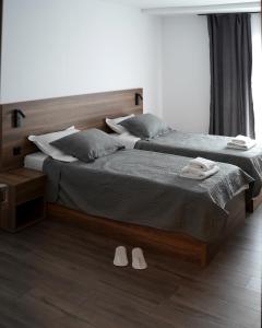 Postel nebo postele na pokoji v ubytování Fole Apart Hotel