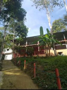 a building with a fence in front of it at Hostal la Gran Ceci in Santa Marta