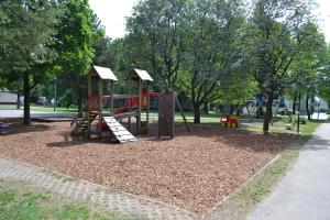 a playground with a slide in a park at Noorteka 3 Apartment in Pärnu