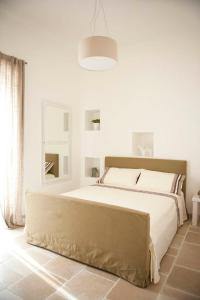 Llit o llits en una habitació de B&B Donnapasqua