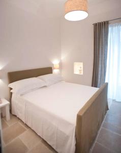 Llit o llits en una habitació de B&B Donnapasqua