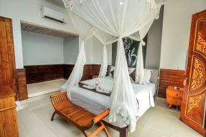 Postel nebo postele na pokoji v ubytování The Tanis Beach Resort Nusa Lembongan