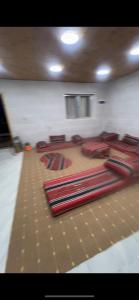a room with a pile of mats on the floor at Moose house in Ajloun