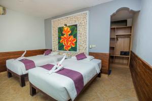 Postel nebo postele na pokoji v ubytování The Tanis Beach Resort Nusa Lembongan
