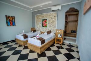 Postel nebo postele na pokoji v ubytování The Tanis Beach Resort Nusa Lembongan