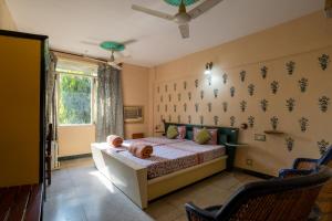 Postel nebo postele na pokoji v ubytování Jaipur Inn
