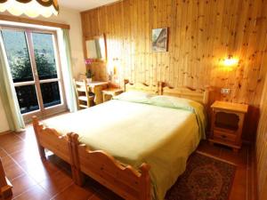 Ένα ή περισσότερα κρεβάτια σε δωμάτιο στο Hotel Alpe Fleurie