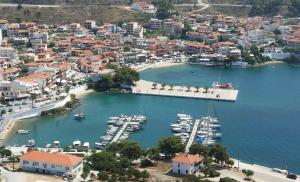 an aerial view of a harbor with boats in the water at Thita Studios ex Anastasiadis House in Neos Marmaras