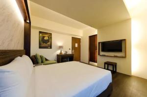 Postel nebo postele na pokoji v ubytování 嬉安平 Si Anping by Hotel Si