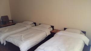 Postel nebo postele na pokoji v ubytování Kathmandu Madhuban Guest House