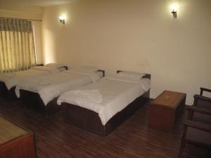 Postel nebo postele na pokoji v ubytování Kathmandu Madhuban Guest House
