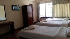 Postel nebo postele na pokoji v ubytování Kathmandu Madhuban Guest House