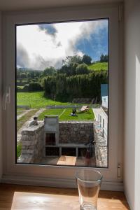 a window in a room with a view of a field at Casa do Simão in Nordeste