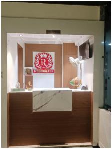 a display window of a store with a sign on it at VARANASI HOTEL R-U-D-R-A-M NEAR KASHI VISHWANATH TEMPLE AND GANGA GHAT - Fully Air Conditioned Rooms - #Wifi #Lift #Parking Available - A Premium Hotel In VARANASI in Varanasi