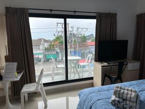 Μια τηλεόραση ή/και κέντρο ψυχαγωγίας στο Apartment Blue Sands