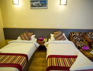 Letto o letti in una camera di Hotel Crown Plaza