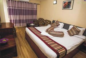 Letto o letti in una camera di Hotel Crown Plaza