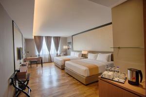 Postel nebo postele na pokoji v ubytování Millesime Hotel Johor Bahru + 31 fotografií