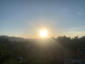 an image of the sun setting over a city at Divine Homestay Kandy in Kandy