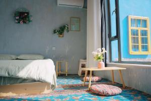 Good Morning International Chain Hostel Of Yining City客房内的一张或多张床位