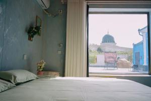 Good Morning International Chain Hostel Of Yining City客房内的一张或多张床位